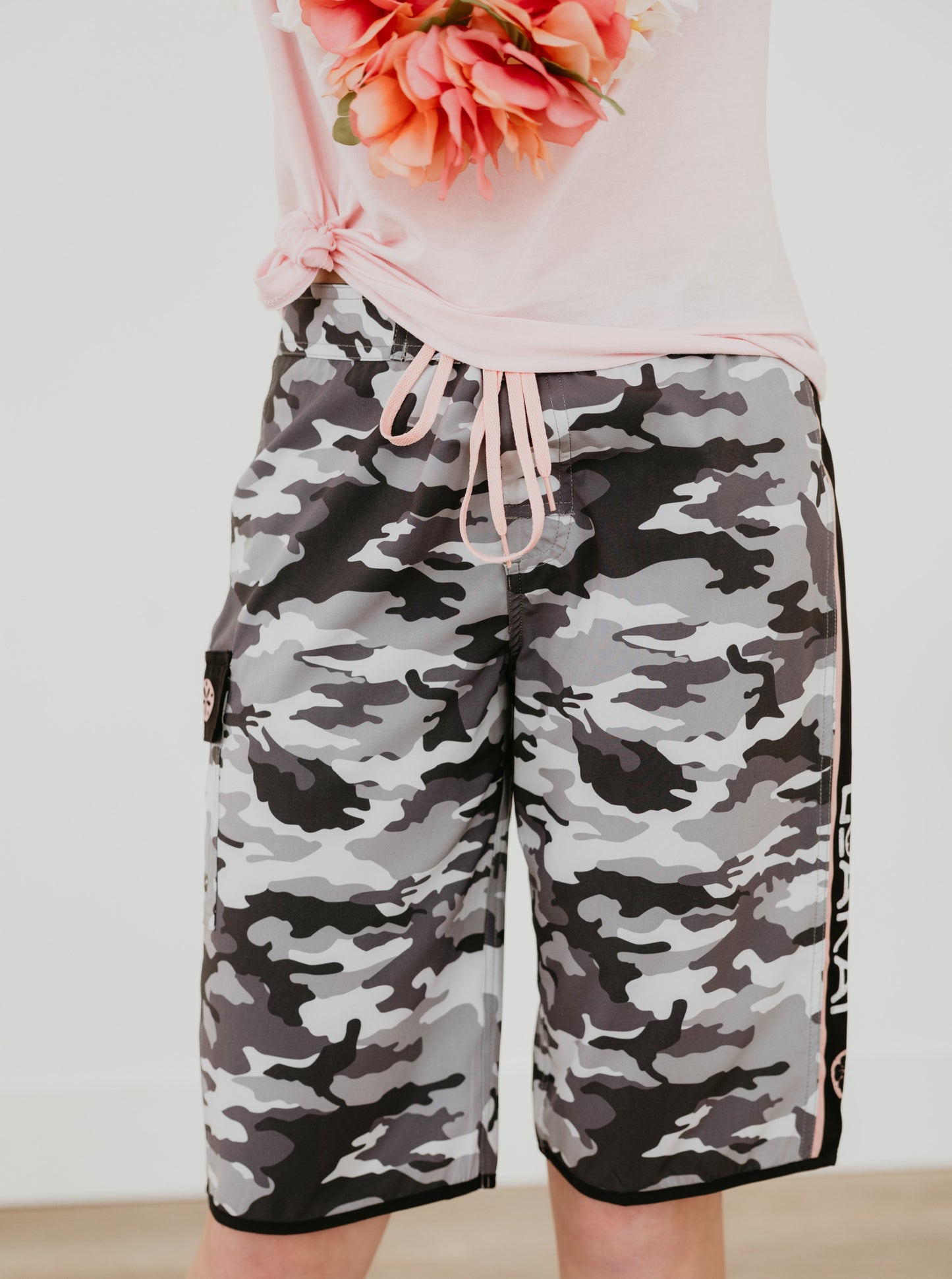 CAMO women's and girls long boardshorts offer a relaxed fashion fit for comfort and a stylish look. The eye-catching design ensures you stand out from the crowd. This premium lightweight and breathable quick dry recycled 4-way stretch fabric helps you stay looking and feeling cool. Complete with side stripe and pocket, these boardshorts will quickly become one of your go-tos.