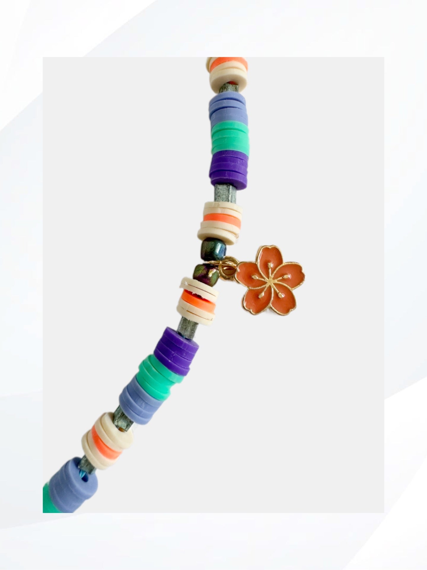 The ORANGE HIBISCUS Stretch Bracelet has an energizing and strengthening vibe. Feel the power of this flower charm. Handmade jewelry that is easy on and off, stylish, fun and unique.